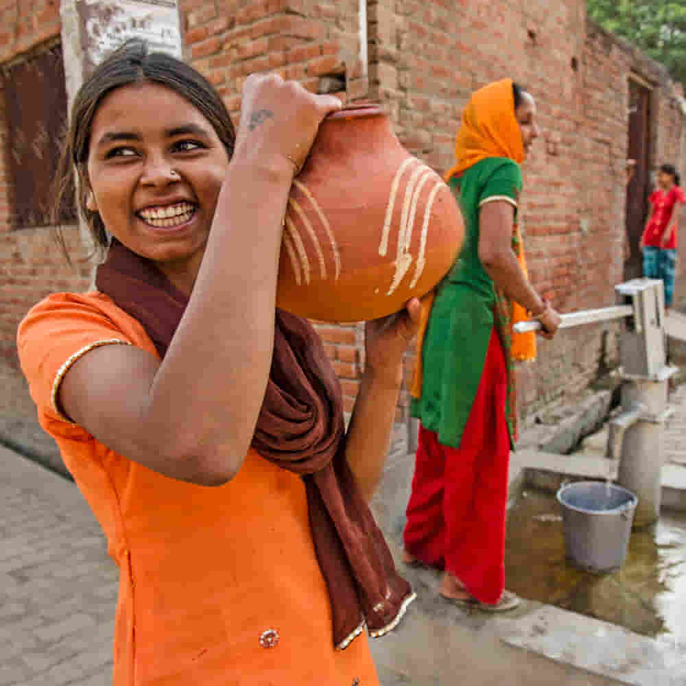 Women acquiring clean water from GFA World Jesus Wells