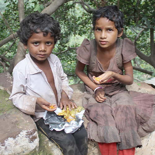 Young slum children in poverty begging on the streets of India