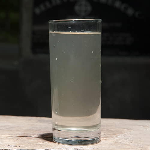 A glass full of contaminated water