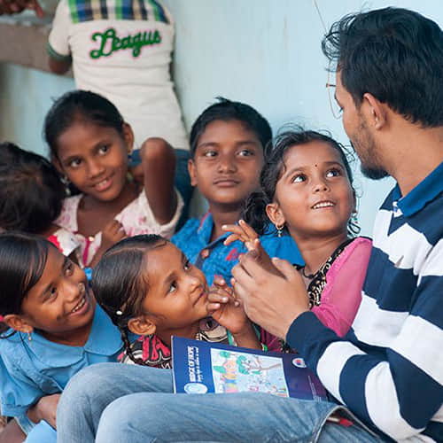 GFA World child sponsorship program missionary worker teaching a group of girls