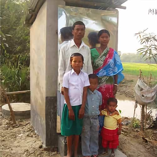 This family benefits from an outdoor toilet gift from GFA World