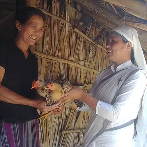 Widow receives income generating gifts of chickens from GFA World through women missionaries