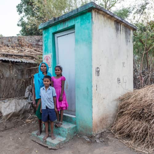 This mother and her children are blessed with sanitation and dignity through GFA World (Gospel for Asia) outdoor toilets