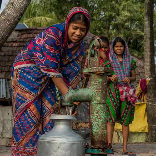 Women drawing clean water through GFA World (Gospel for Asia) Jesus Wells