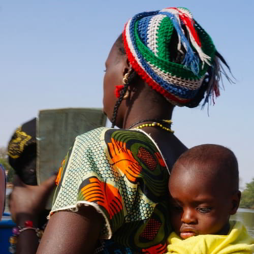 Africa woman carrying her child
