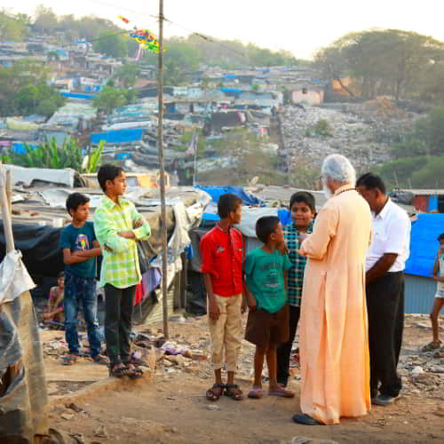 GFA World (Gospel for Asia) missionaries and Dr. K.P. Yohannan share the love of Jesus to children living in the slums of South Asia