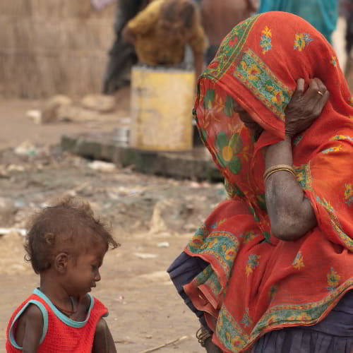 Mother and child living in a slum in South Asia