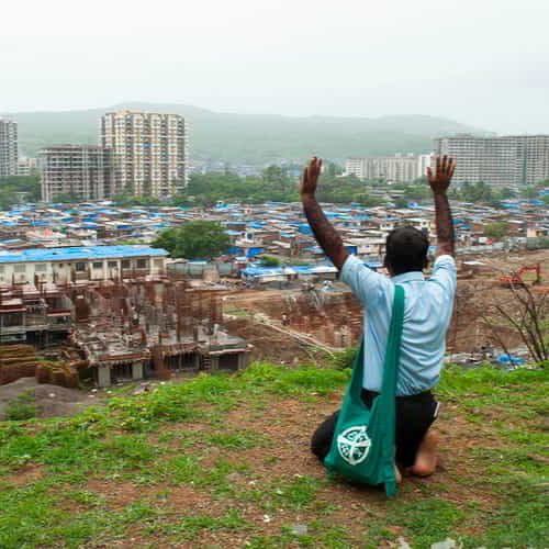 GFA World (Gospel for Asia) missionary praying for slum communities