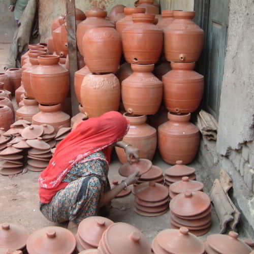 Woman clay pot maker in the slum communities of South Asia