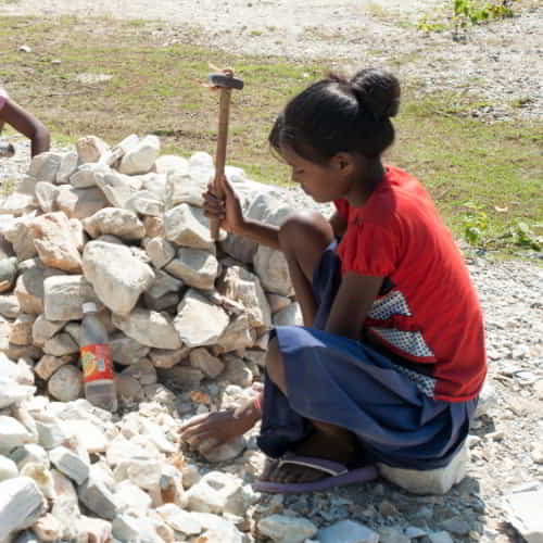 Young girl in child labor in a quarry in South Asia