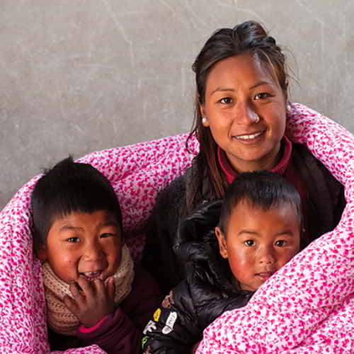 Rosina's family received extreme cold relief through GFA World gift distribution of warm blankets