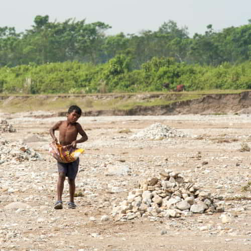 Young boy in child labor in a quarry in South Asia