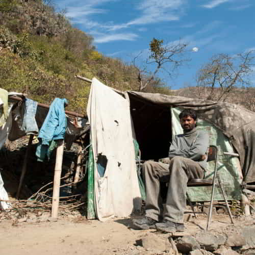 Man living in extreme poverty in South Asia slums