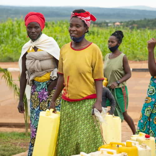 Group of women in Rwanda, Africa, collecting clean water through GFA World Jesus Wells