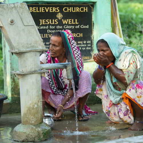 Women enjoying access to clean water through GFA World Jesus Wells