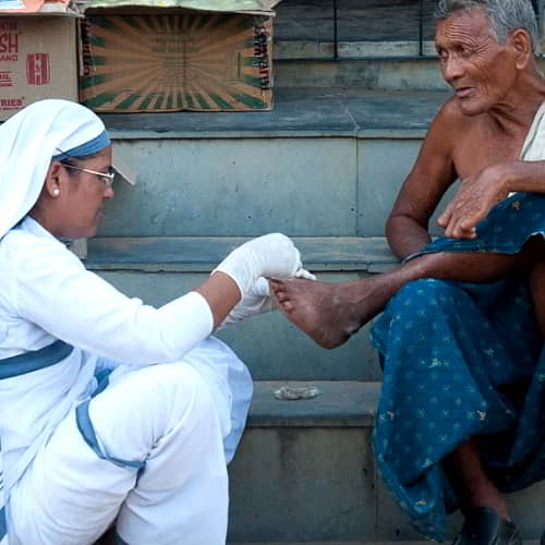 Sisters of Compassion cleaning wounds of leprosy patients through GFA World Leprosy Ministry