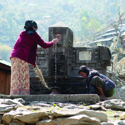 Women in South Asia collecting clean water