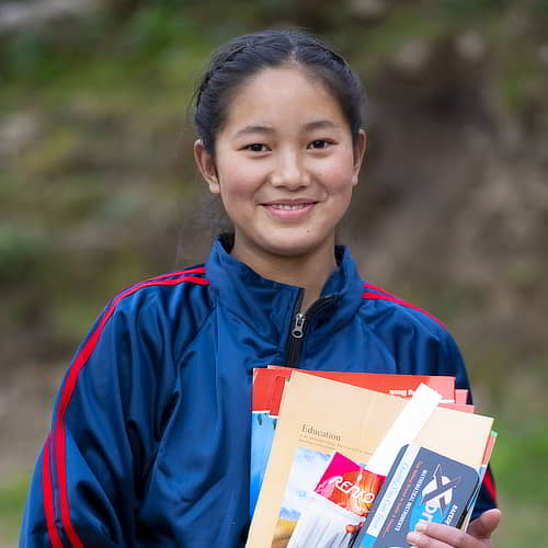 This girl received school supplies through the child sponsorship program of GFA World, an South Asia Underprivileged Kids Charity