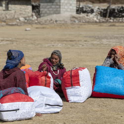 Women received warm blankets through GFA World winter aid programs