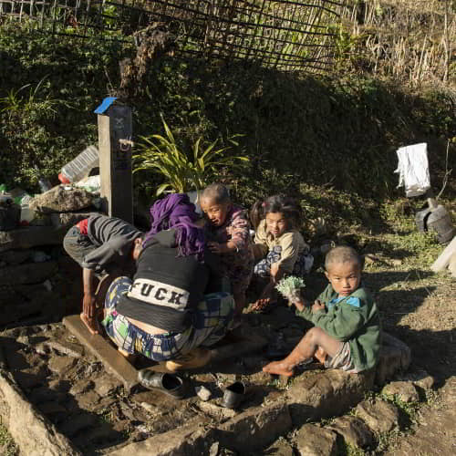 Family in poverty in a slum in Asia