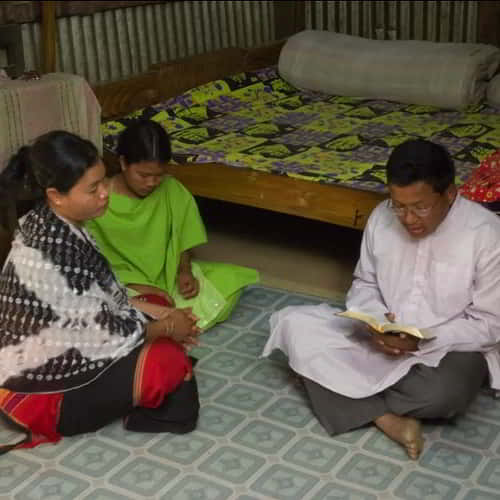 GFA World Pastor leads a family in prayer and Scripture, serving as an Ambassador for Christ bringing hope and faith in Jesus